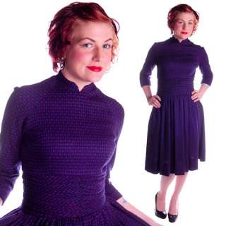 Lovely deep navy and violet checks make up this nicely fitted dress by 