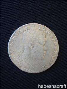 This is a large Ethiopian Emperor Menelik silver 1 birr coin issued in 
