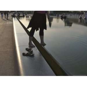  Young Woman Steps into the Reflecting Pool at the Louvre 