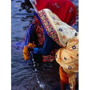 Women Washing Saris at Man Mandir Ghat, Varanasi, Uttar Pradesh, India 
