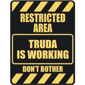   RESTRICTED AREA TRUDA IS WORKING  PARKING SIGN