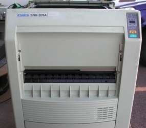 What you are bidding on is a Konica Minolta SRX 201A Mid Volume 