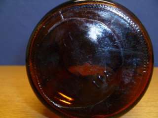 This is a beautiful Vintage Dark Amber wide mouth sprouting jar in 