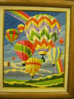 FRAMED CREWEL EMBROIDERY PICTURE OF HOT AIR BALLOONS.  