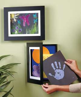 forget magnets on the refrigerator and use easy change artwork frames 