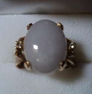 white opal and gold ring called cocktail knuckle dusters and all the 